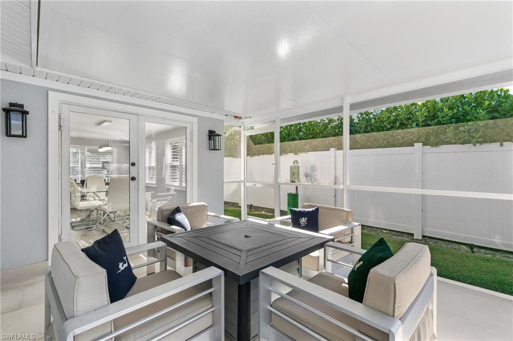 2270 Harbor Road Naples, FL 34104 - Photo 16 of 21 a living room with furniture and a table