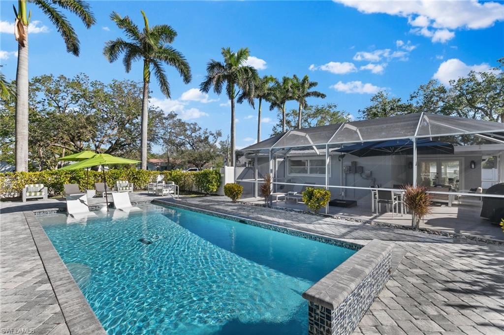 2270 Harbor Road Naples, FL 34104 - Photo 19 of 21 a view of a house with backyard porch and sitting area