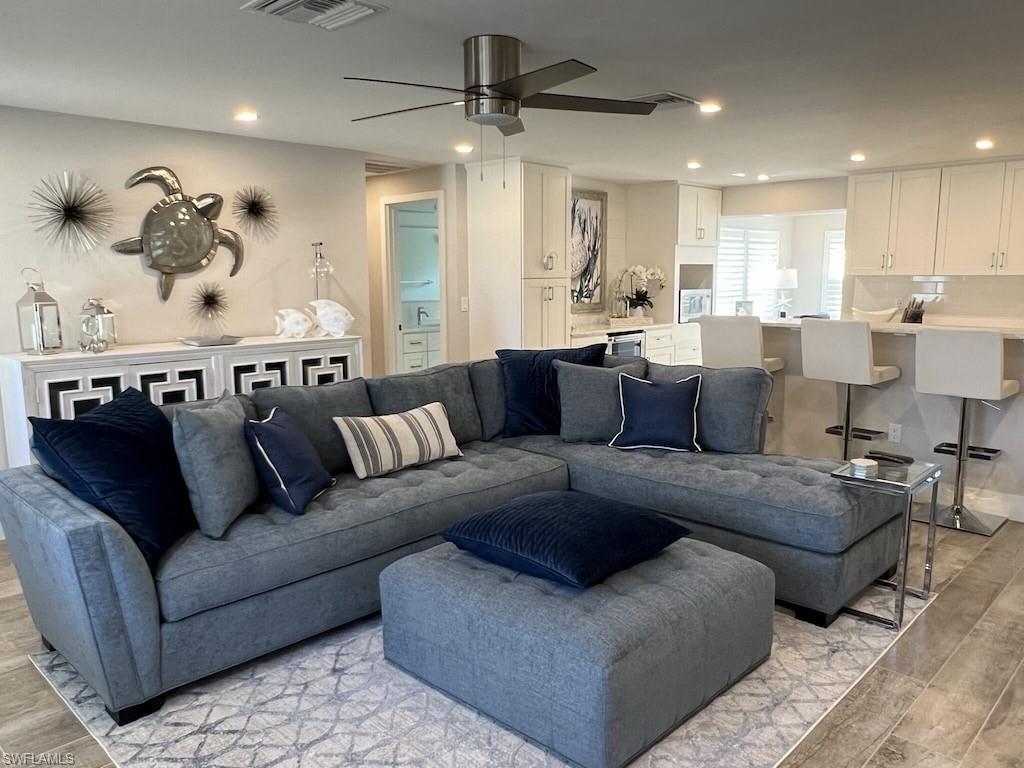 2270 Harbor Road Naples, FL 34104 - Photo 2 of 21 a living room with furniture and kitchen view