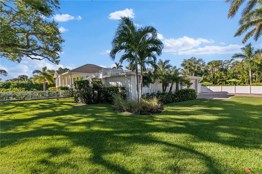 2270 Harbor Road Naples, FL 34104 - Photo 21 of 21 a front view of a house with a garden