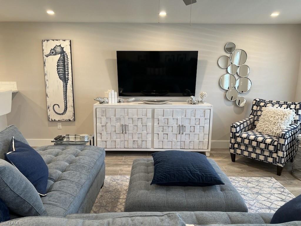 2270 Harbor Road Naples, FL 34104 - Photo 3 of 21 a living room with furniture and a flat screen tv