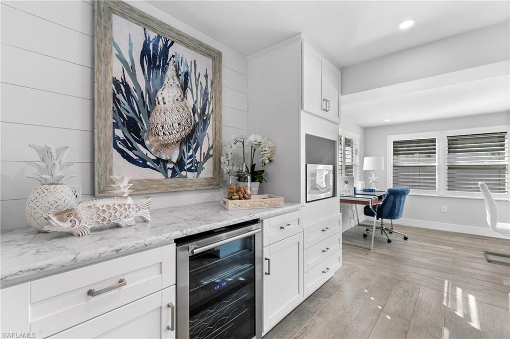 2270 Harbor Road Naples, FL 34104 - Photo 6 of 21 a spacious bathroom with a granite countertop sink and a large mirror