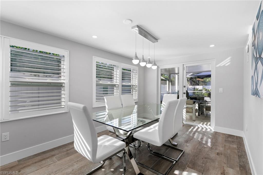 2270 Harbor Road Naples, FL 34104 - Photo 7 of 21 a view of a dining room with furniture window and wooden floor