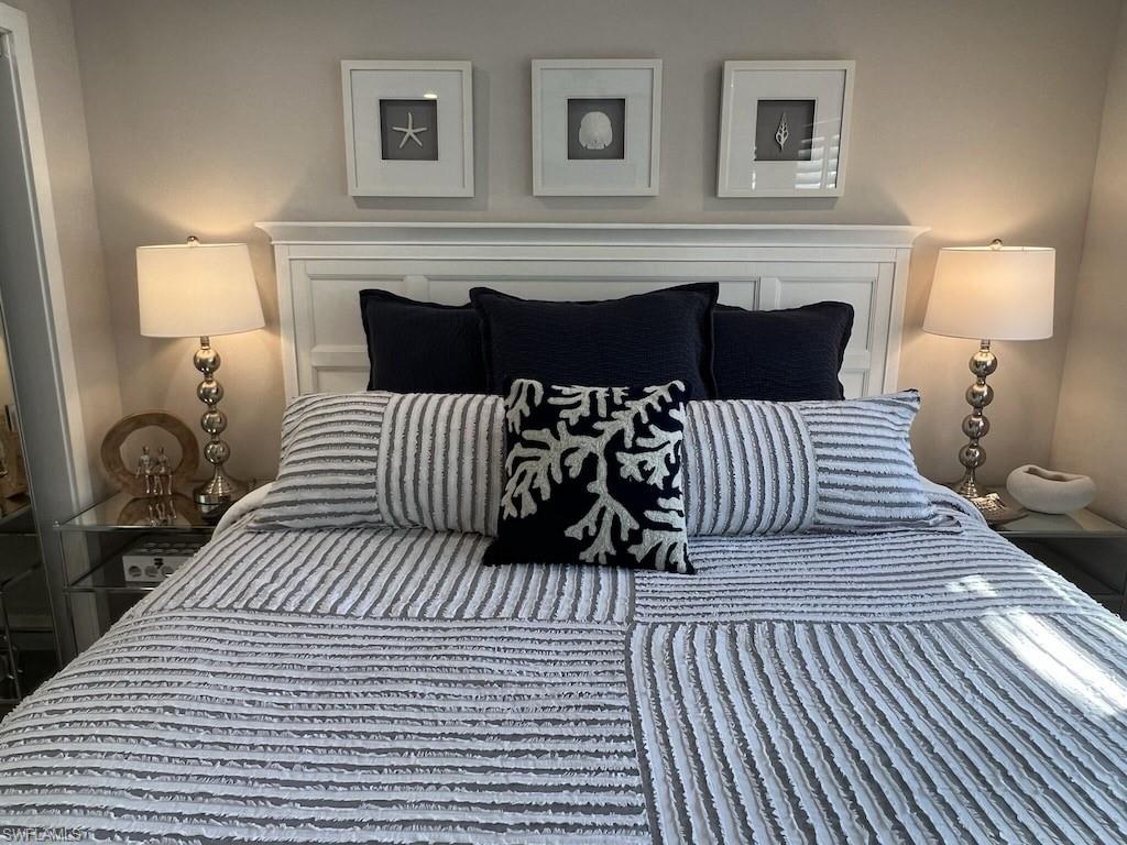 2270 Harbor Road Naples, FL 34104 - Photo 8 of 21 a bedroom with a bed and wooden floor