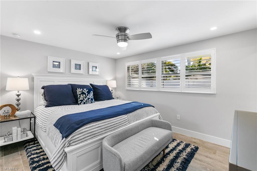 2270 Harbor Road Naples, FL 34104 - Photo 9 of 21 a bedroom with a large bed and a window