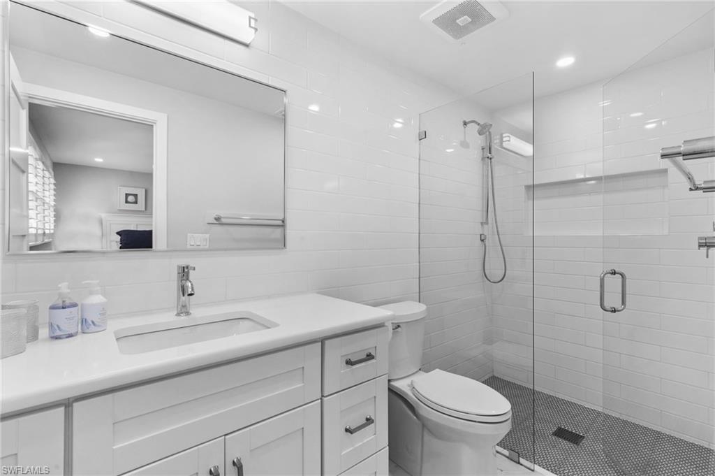 2270 Harbor Road Naples, FL 34104 - Photo 10 of 21 a bathroom with a sink toilet and shower