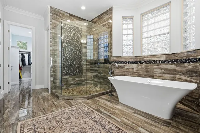 a bathroom with a bathtub and a shower