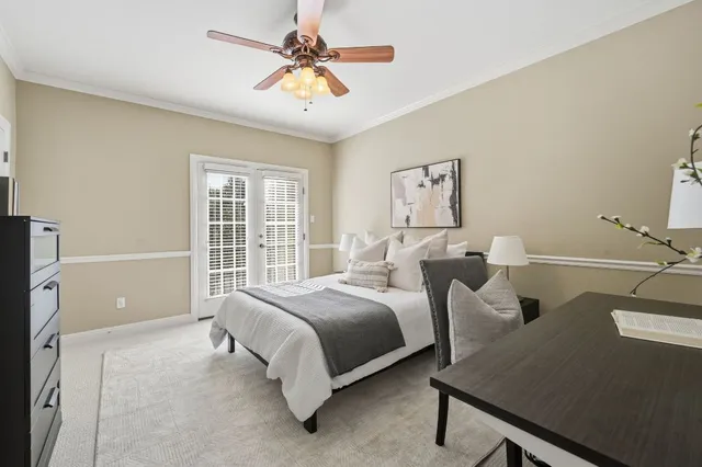 a spacious bedroom with two beds and a large window