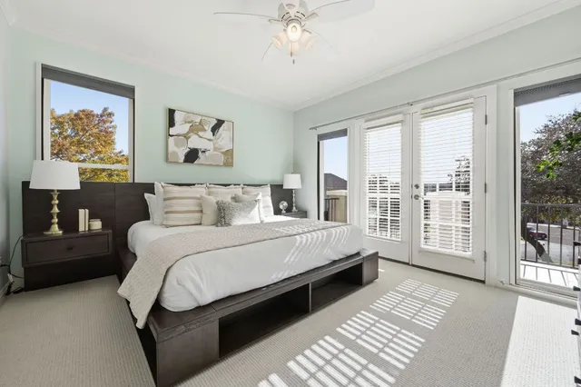 a bedroom with a large bed and a window