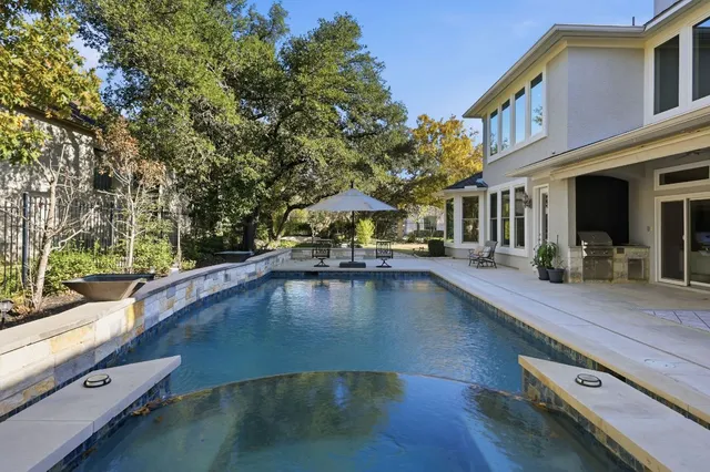 a view of a swimming pool with a patio