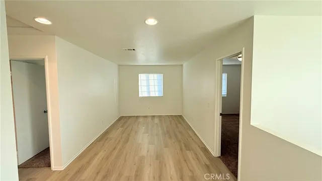 a view of an empty room and window