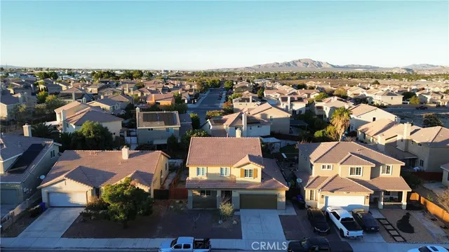 an aerial view of a house with a city view