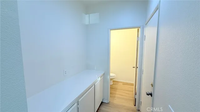 a white toilet sitting next to a bathroom sink