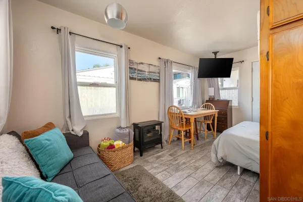 a bedroom with furniture and a window
