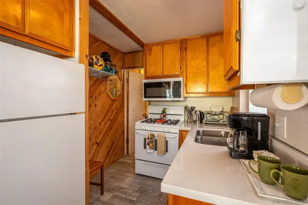 a kitchen with stainless steel appliances granite countertop a stove and a sink