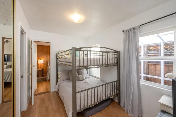 a bedroom with a large bed and a large window