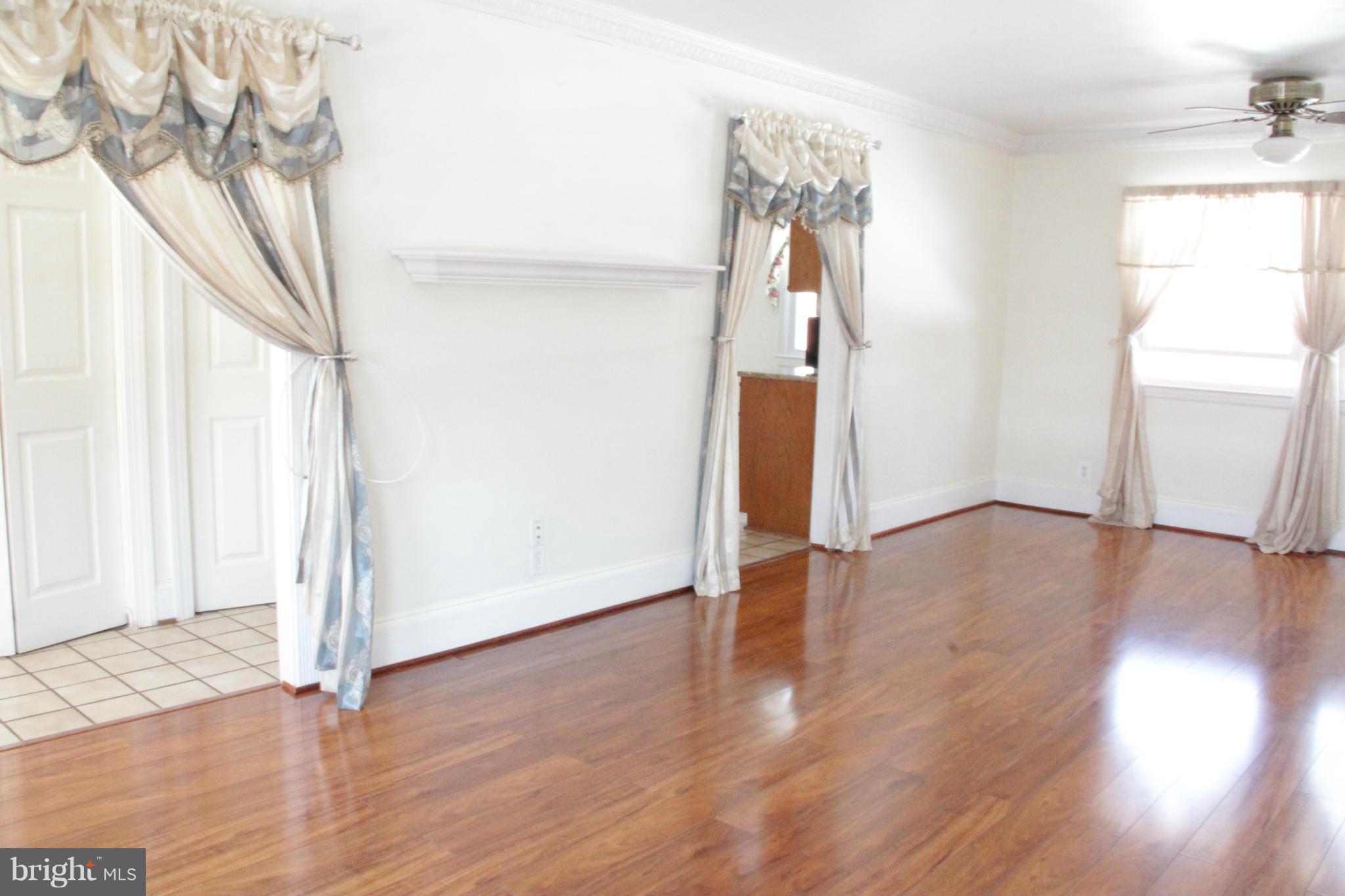 204 West Ash Road Sterling, VA 20164 - Photo 6 of 14 a view of empty room with wooden floor and fan