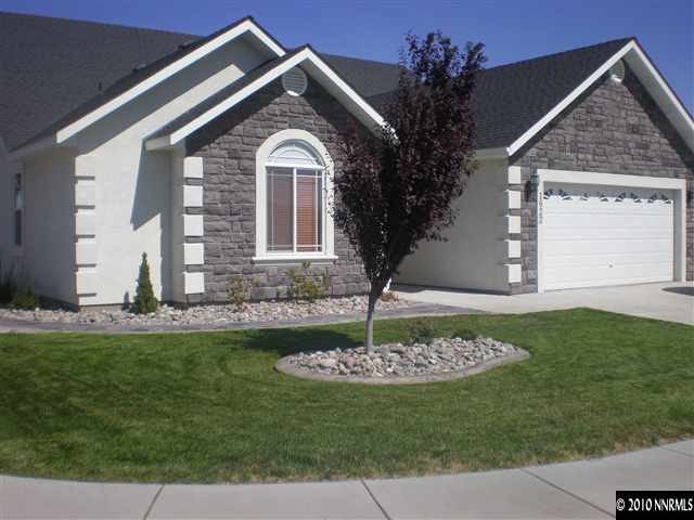 1622 Ray Court Fernley, NV 89408 - Photo 1 of 9 a front view of a house with a garden