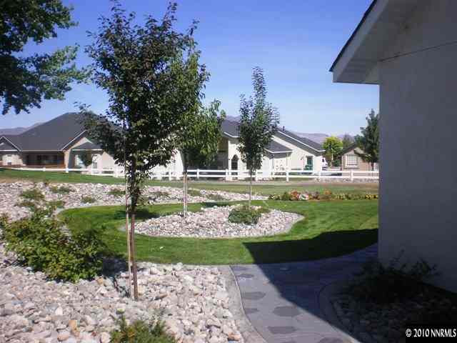 1622 Ray Court Fernley, NV 89408 - Photo 2 of 9 a view of a garden with flowers and trees