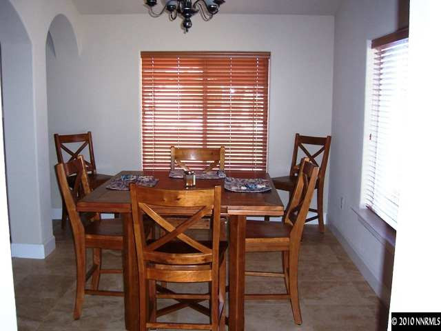 1622 Ray Court Fernley, NV 89408 - Photo 8 of 9 a view of a dining room with furniture and windows