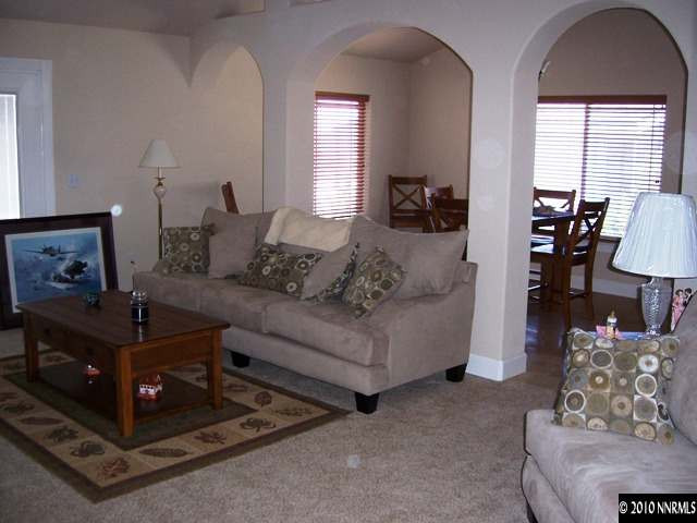 1622 Ray Court Fernley, NV 89408 - Photo 9 of 9 a living room with furniture and a fireplace