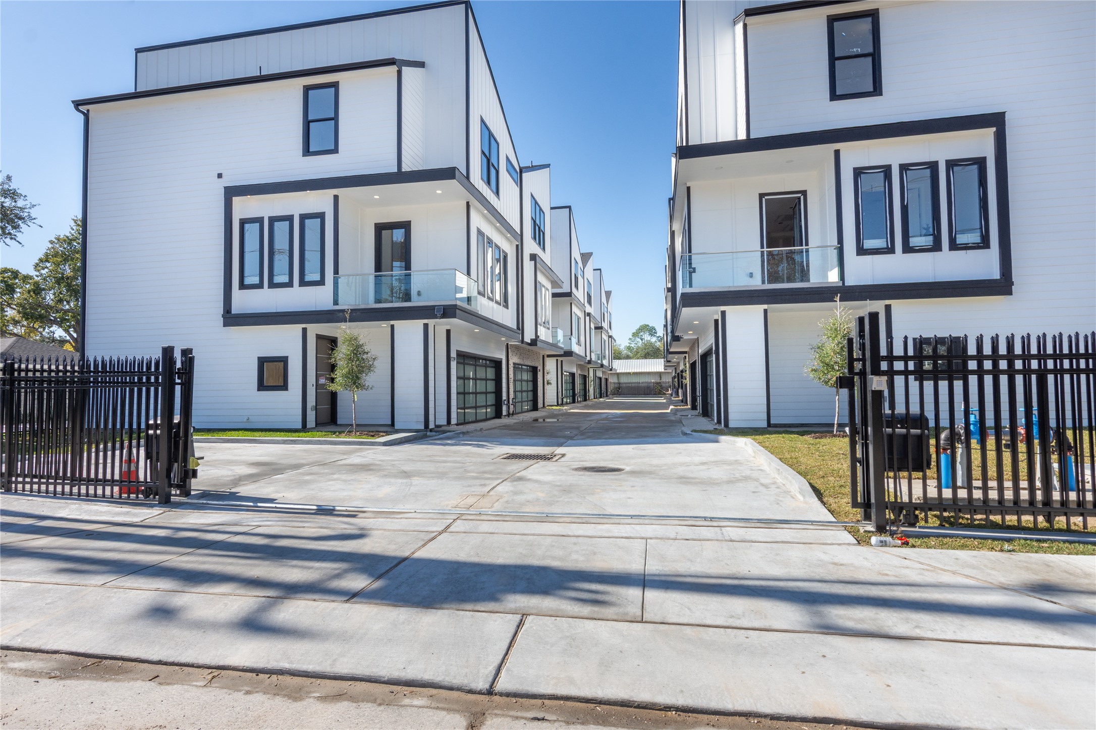 a view of a brick building next to a road