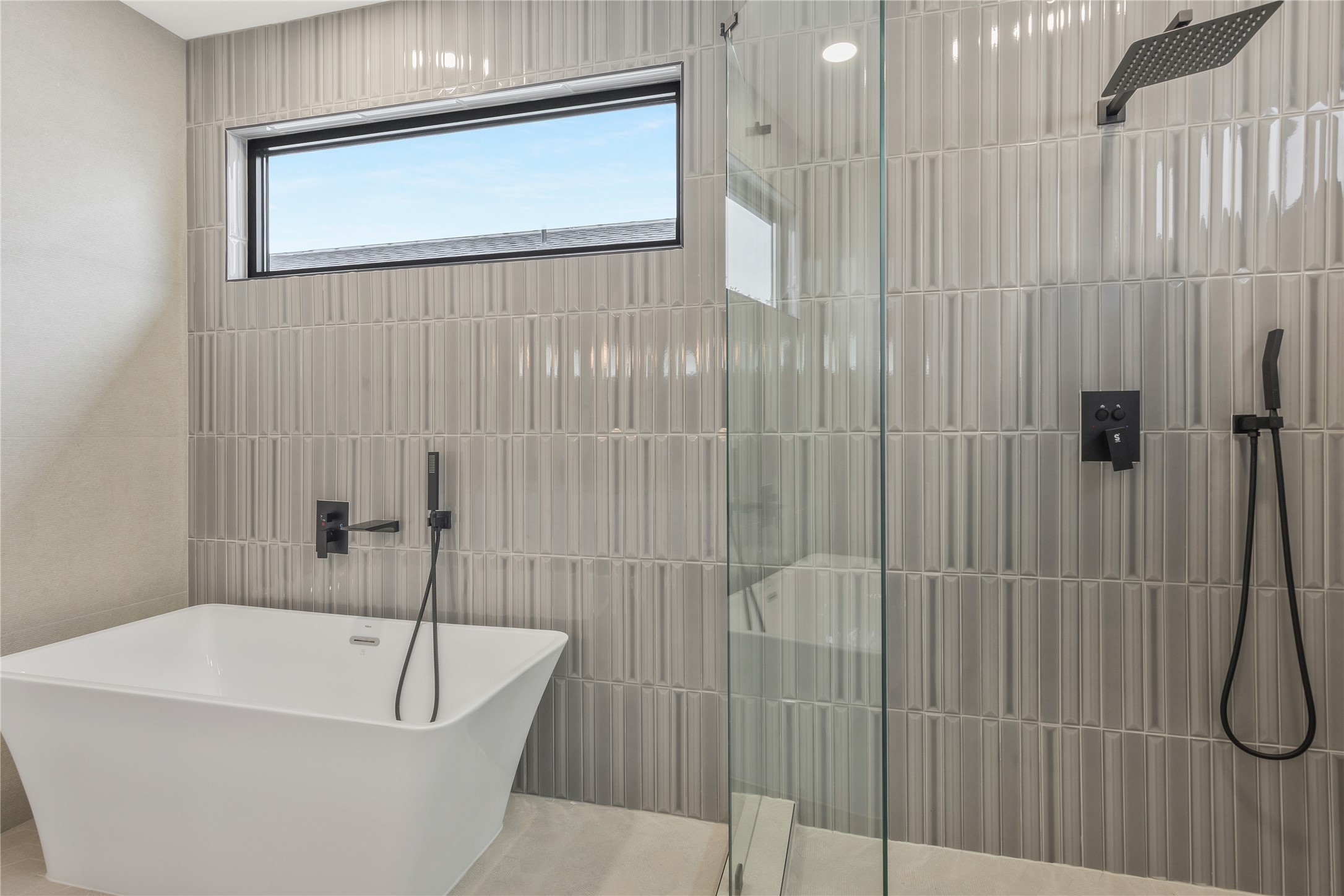 2235 Blalock Road Houston, TX 77080 - Photo 24 of 33 a bathroom with a white bath tub and a shower