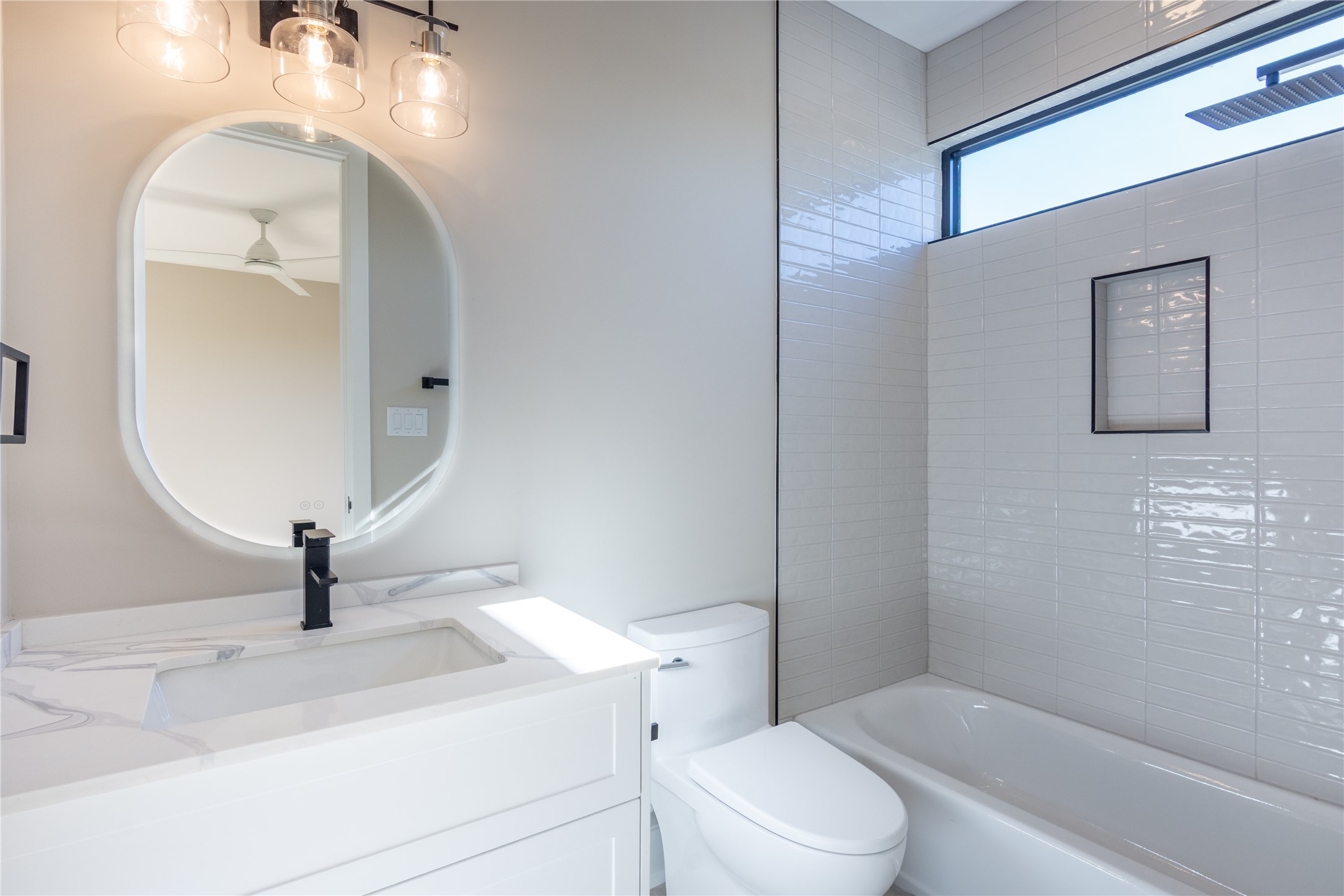 2235 Blalock Road Houston, TX 77080 - Photo 30 of 33 a bathroom with a sink a toilet and a mirror