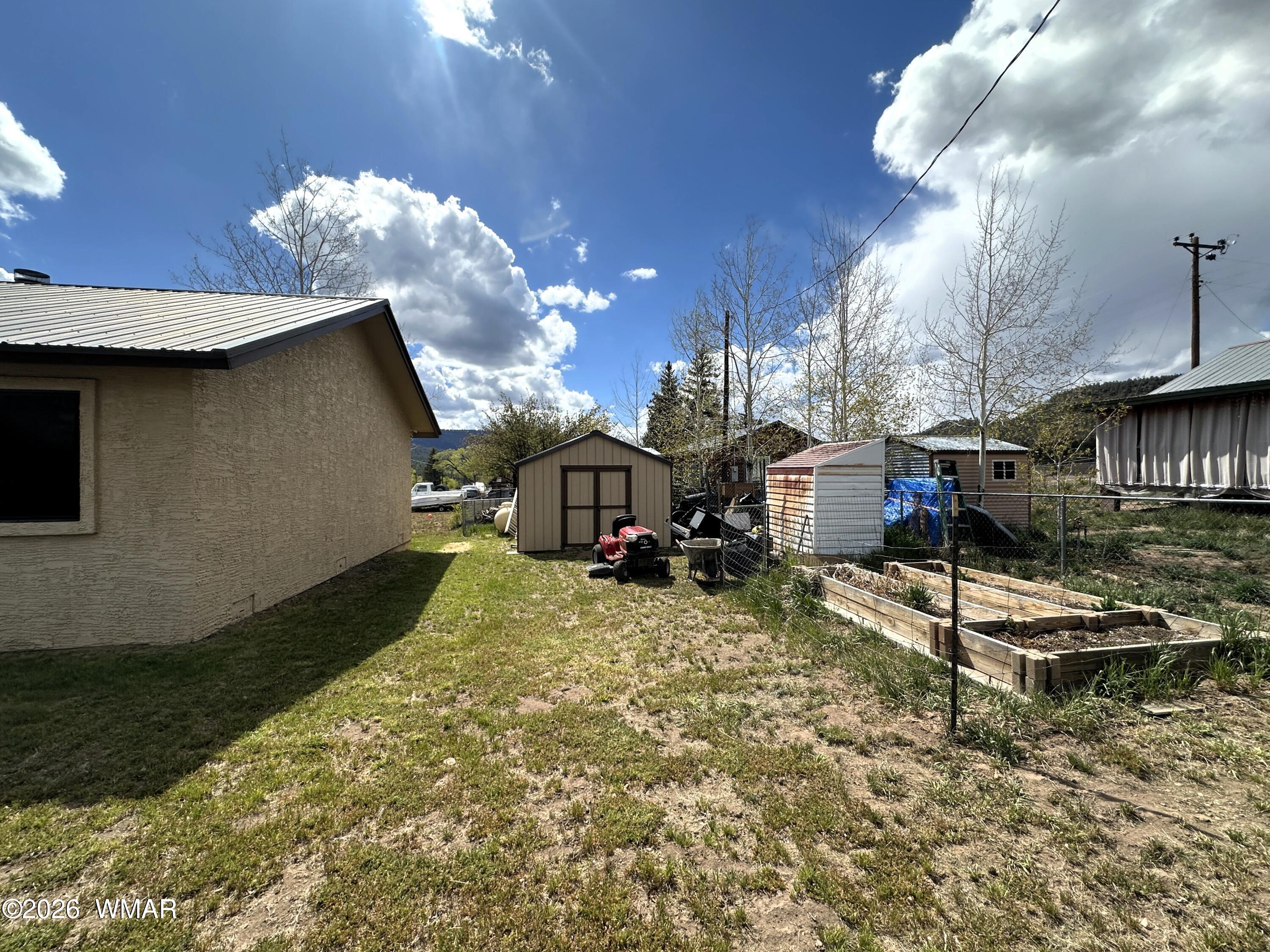 19 County Road Alpine, AZ 85920 - Photo 25 of 27 a view of a house with a yard