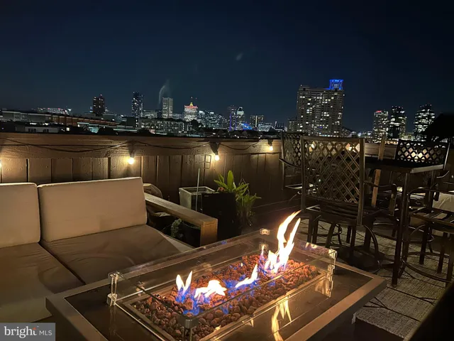 a kitchen with stainless steel appliances a refrigerator sink and microwave