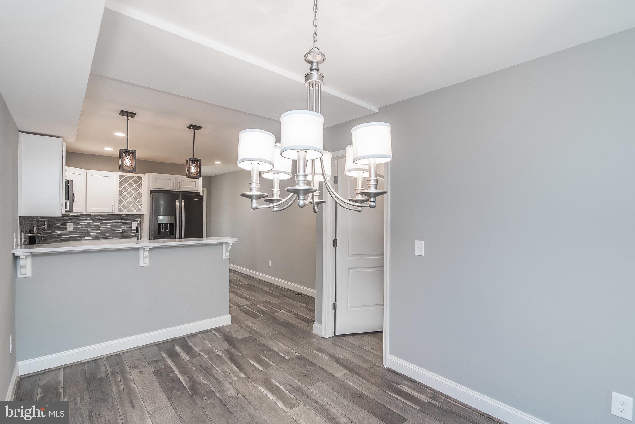 704 East Fort Avenue Baltimore, MD 21230 - Photo 13 of 58 a view of a kitchen with wooden floor