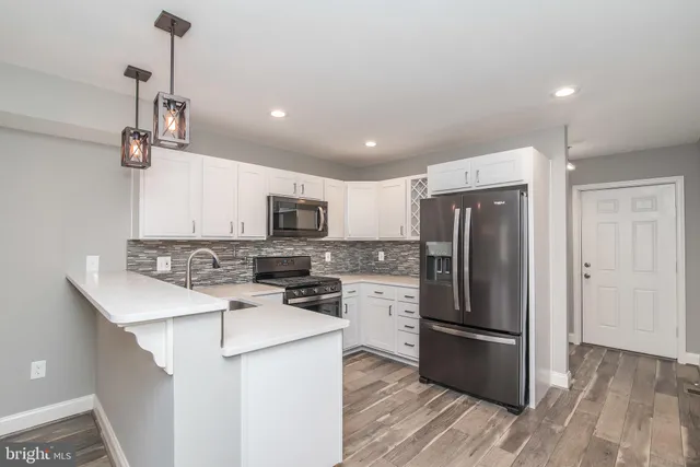 a kitchen with a stove and a microwave