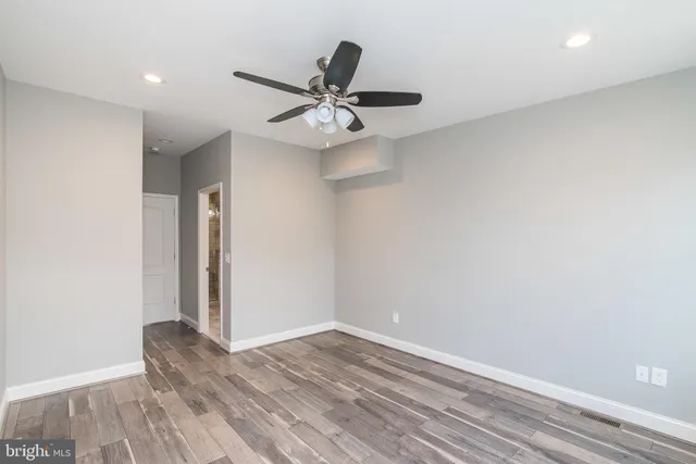 a view of front door with wooden floor
