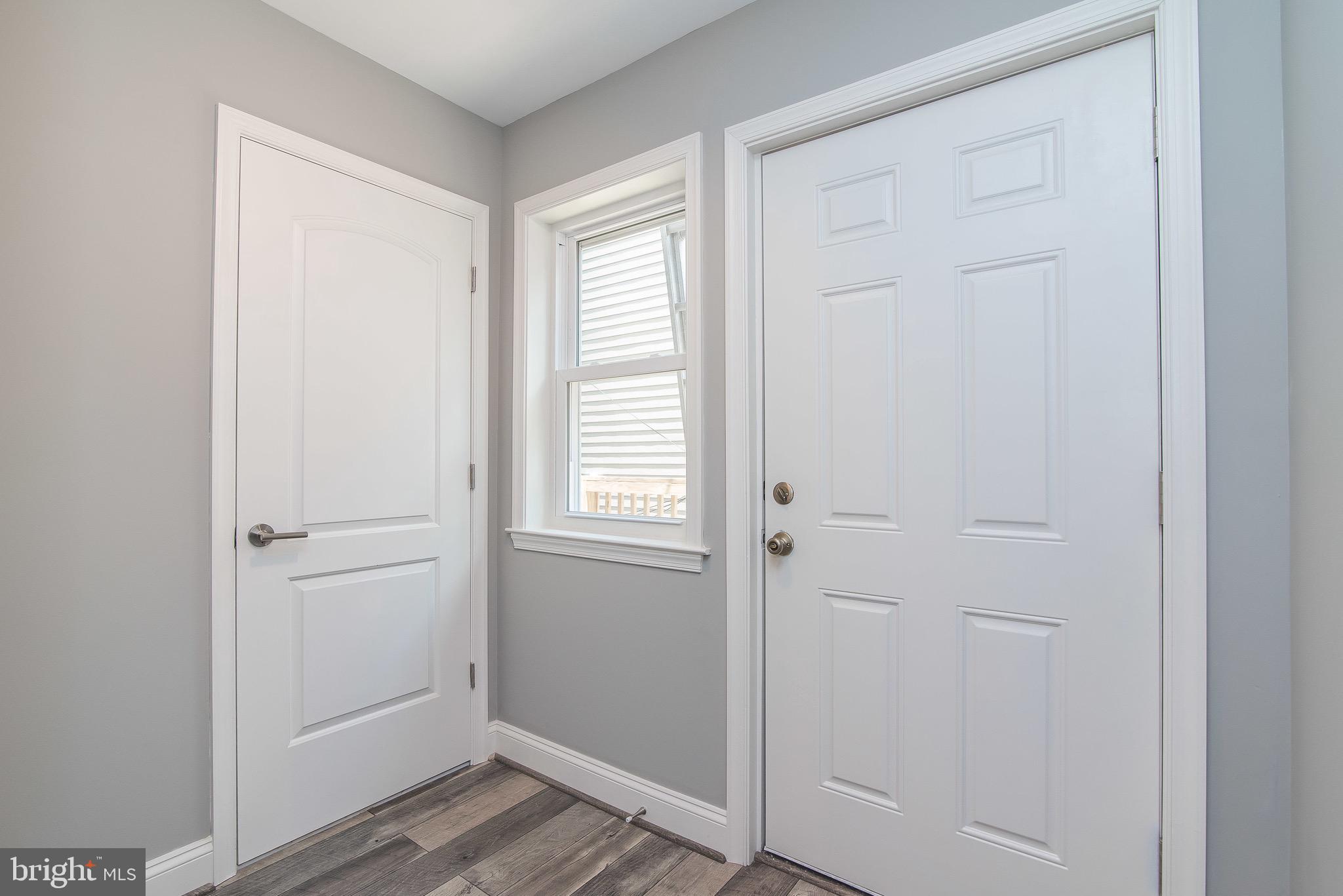 704 East Fort Avenue Baltimore, MD 21230 - Photo 36 of 58 a view of front door with wooden floor