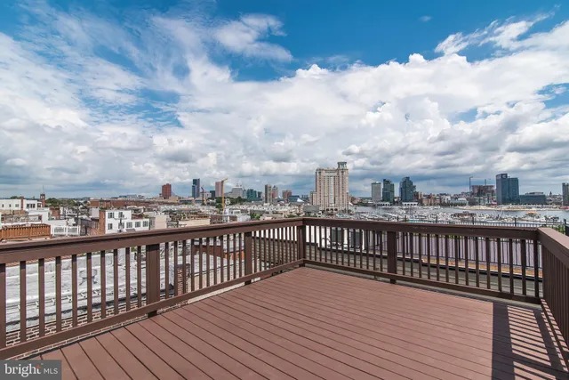 a view of a balcony with wooden floor