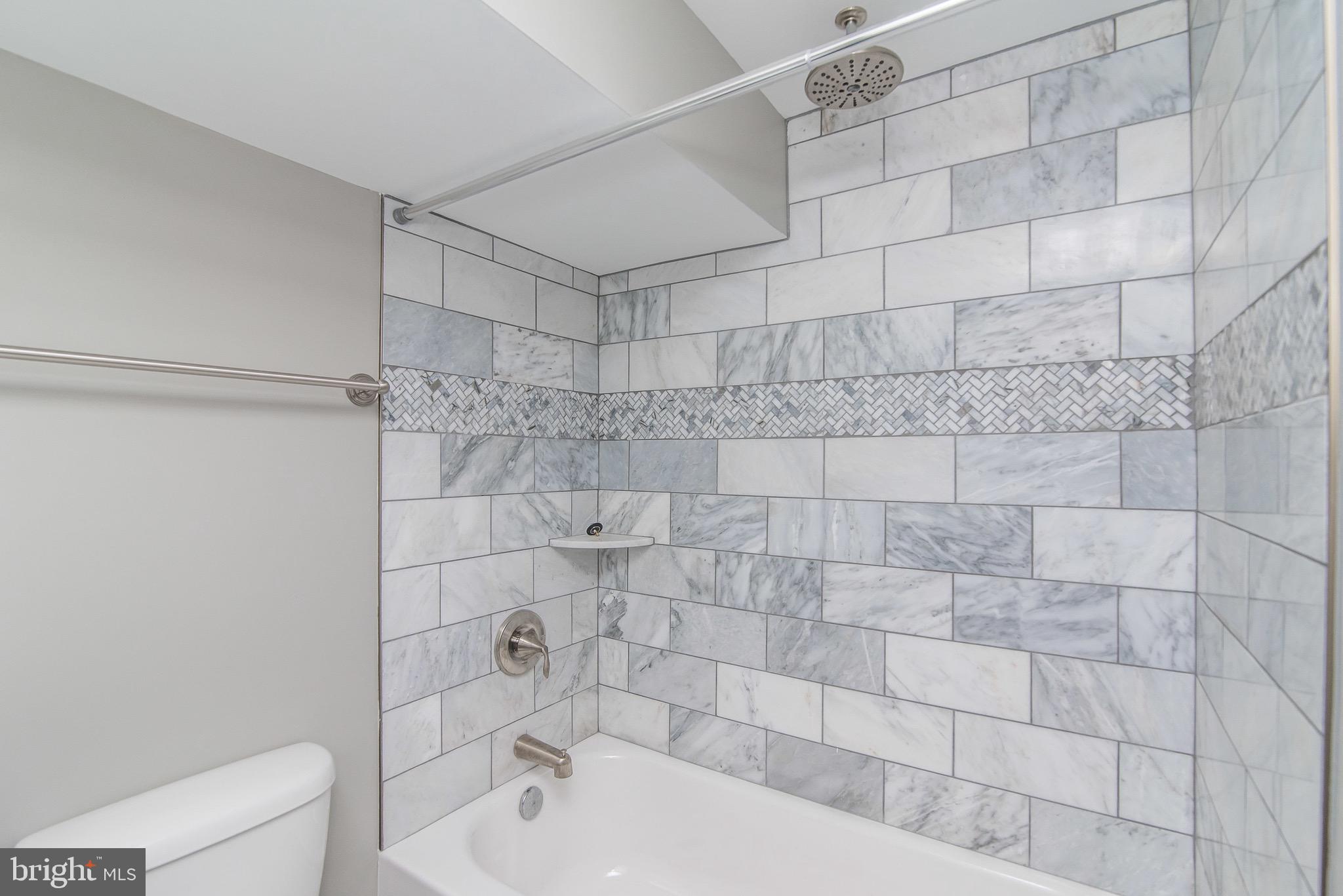 704 East Fort Avenue Baltimore, MD 21230 - Photo 4 of 58 a bathroom with a shower