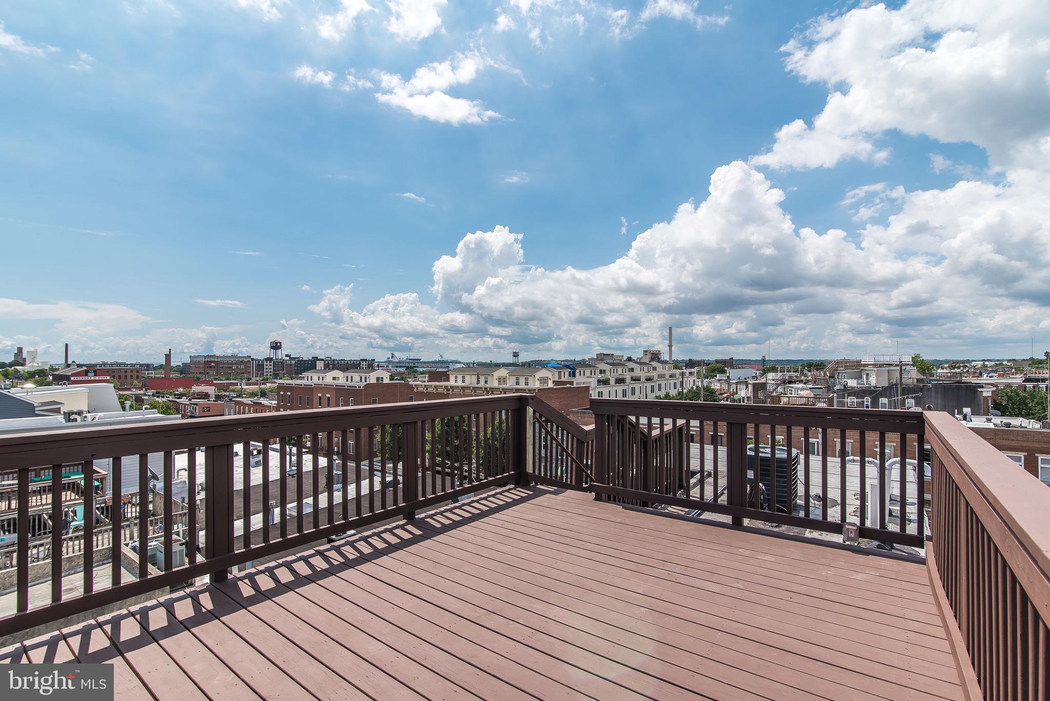 704 East Fort Avenue Baltimore, MD 21230 - Photo 41 of 58 a view of a balcony with wooden floor