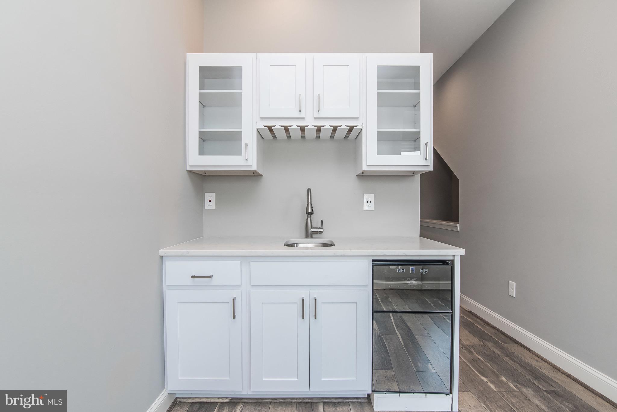 704 East Fort Avenue Baltimore, MD 21230 - Photo 45 of 58 a bathroom with a sink and a mirror
