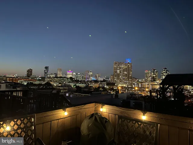 a terrace with outdoor seating and city view