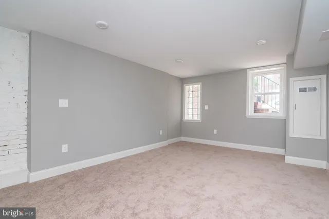 a view of an empty room with closet area