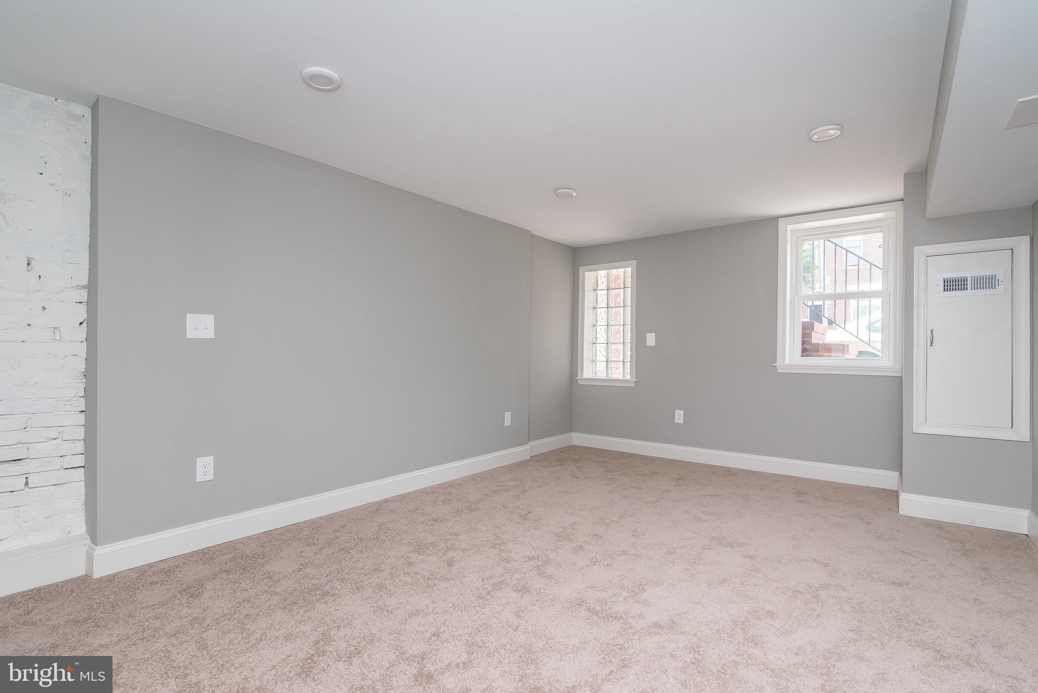 704 East Fort Avenue Baltimore, MD 21230 - Photo 6 of 58 a view of an empty room with windows
