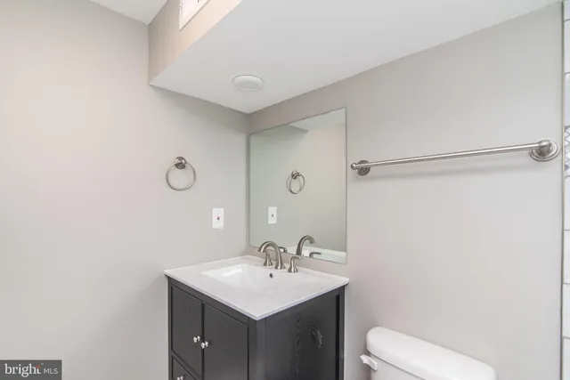 a view of an empty room and wooden floor