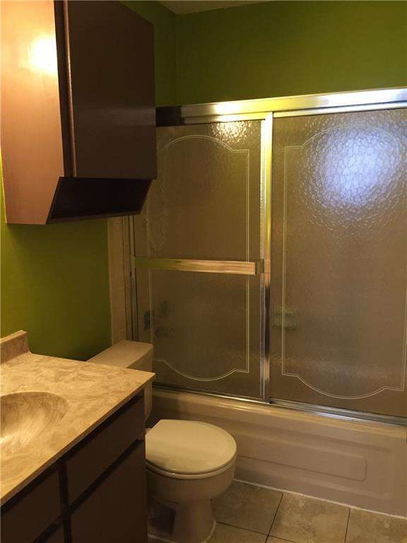 3000 Guadalupe Street, Unit 307 Austin, TX 78705 - Photo 12 of 21 a bathroom with a granite countertop sink toilet and shower