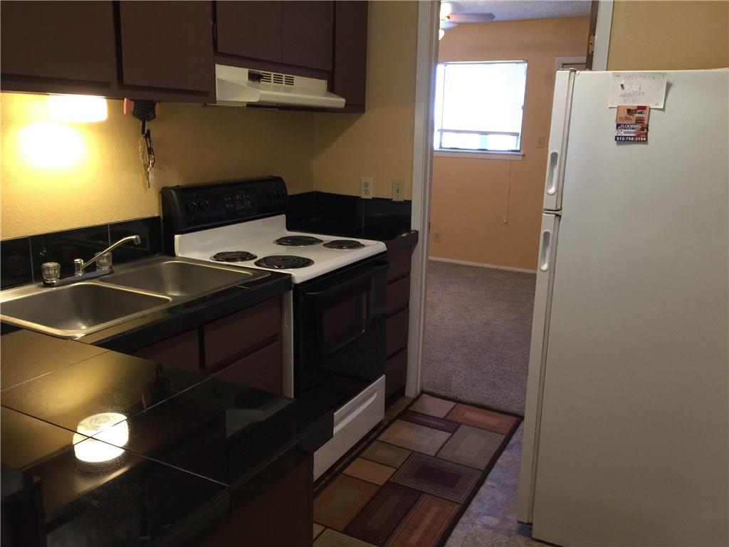 3000 Guadalupe Street, Unit 307 Austin, TX 78705 - Photo 9 of 21 a kitchen with a sink and a stove