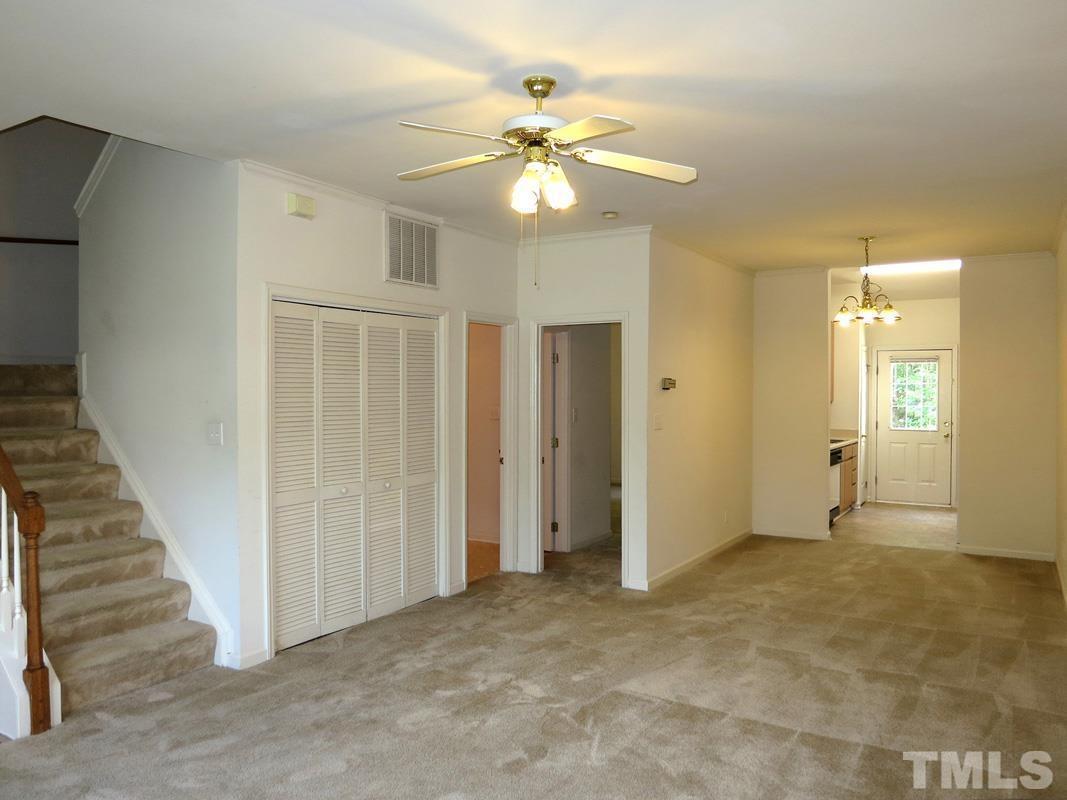 101 Rock Haven Road, Unit D402 Carrboro, NC 27510 - Photo 2 of 14 a view of an empty room with a chandelier fan