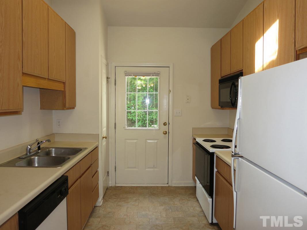 101 Rock Haven Road, Unit D402 Carrboro, NC 27510 - Photo 5 of 14 a kitchen that has a sink and a stove