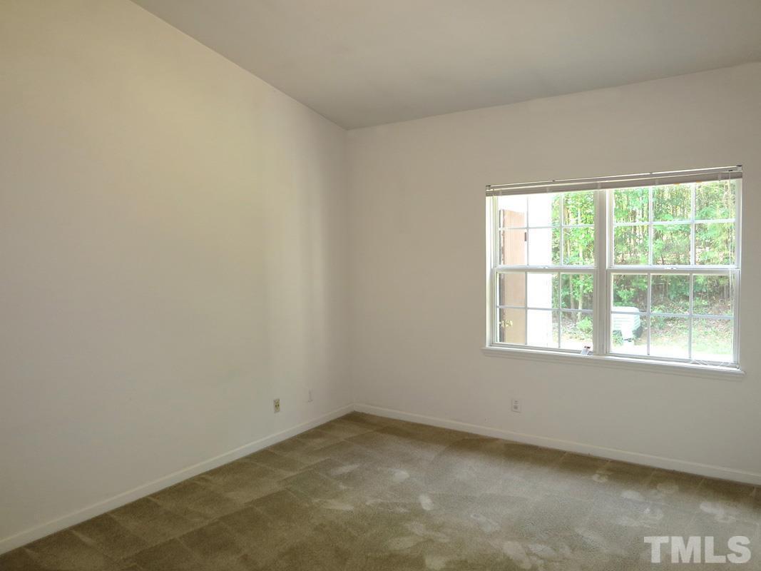 101 Rock Haven Road, Unit D402 Carrboro, NC 27510 - Photo 6 of 14 an empty room with a window