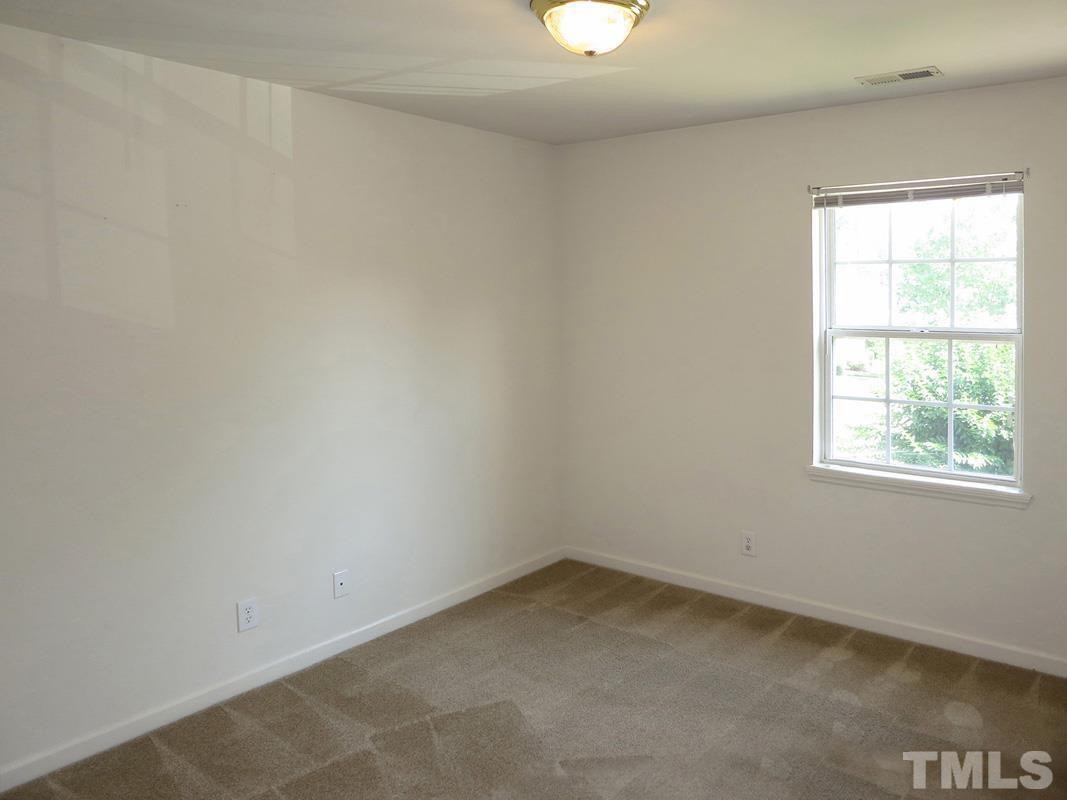 101 Rock Haven Road, Unit D402 Carrboro, NC 27510 - Photo 8 of 14 an empty room with a window