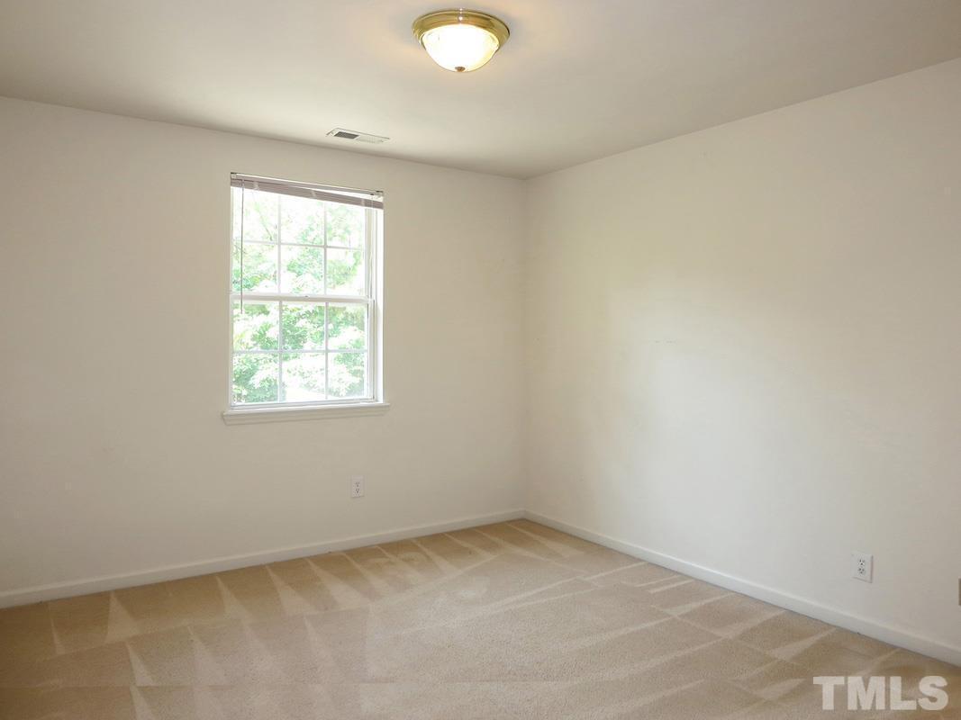 101 Rock Haven Road, Unit D402 Carrboro, NC 27510 - Photo 9 of 14 an empty room with a window