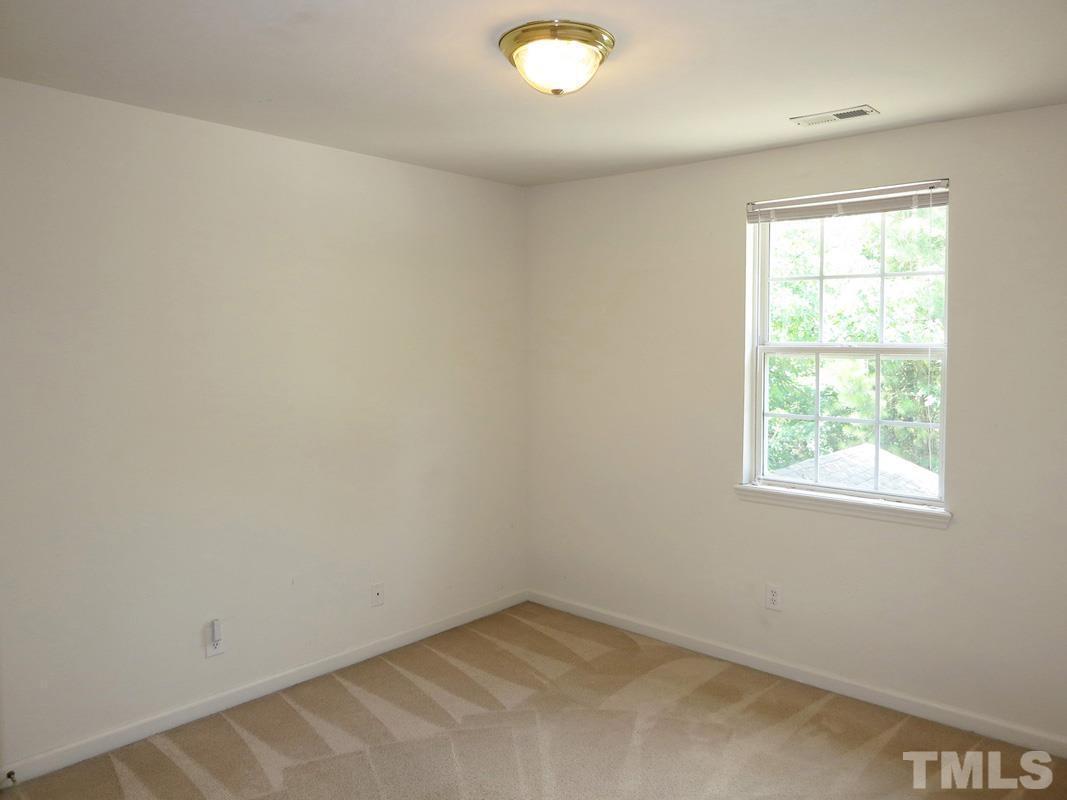 101 Rock Haven Road, Unit D402 Carrboro, NC 27510 - Photo 10 of 14 an empty room with a window